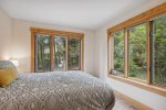 Queen bedroom with forested view 